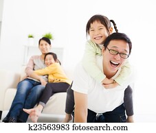 happy asian family in the living room happy asian family in the living room