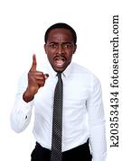 Portrait of angry african businessman over white background