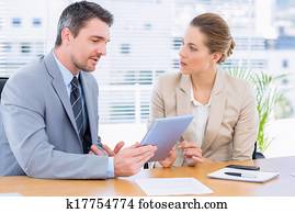 Smartly dressed colleagues in business meeting