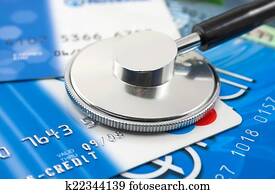 A stethoscope by a Credit cards payment