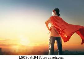 Doctor wearing facemask and superhero cape Doctor wearing facemask and superhero cape