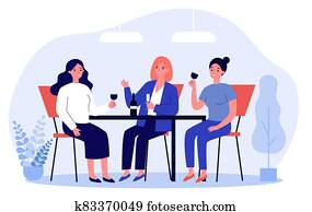 Happy female friends hanging out in cafe