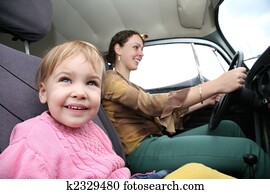 child with mother in car