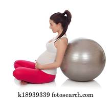 Beautiful pregnant woman doing pilates