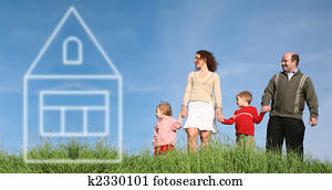 family on grass with house of dream