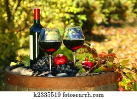Glasses of red wine on old barrel Glasses of red wine on old barrel