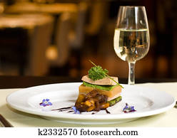 Gourmet dish and white wine, restaurant. Gourmet dish and white wine, restaurant.