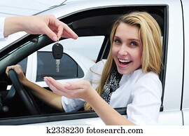 happy woman receiving car key
