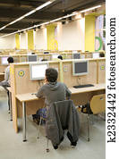 people in internet cafe