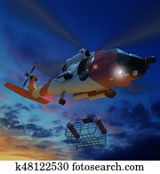 Coast guard helicopter lowering a rescue basket during for rescue flying. Coast guard helicopter lowering a rescue basket during for rescue flying.
