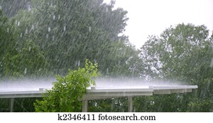 Raining over a white roof in a hurricane storm Raining over a white roof in a hurricane storm