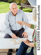 Senior Couple Playing Dominoes Senior Couple Playing Dominoes