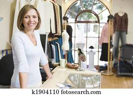 Woman at clothing store smiling