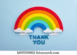 Thank you rainbow banner. Rainbow ob blue background with letters Thank you rainbow banner. Rainbow ob blue background with letters