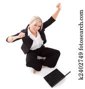 beautiful businesswoman punches the air