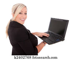 beautiful businesswoman uses laptop and Internet