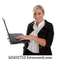 beautiful businesswoman uses laptop and Internet