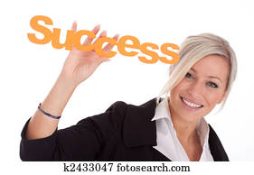 beautiful young businesswoman halts success in her hands