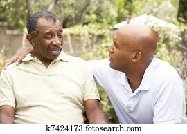 Senior Man Having Serious Conversation Adult Son