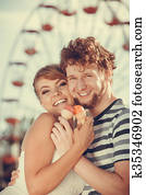 young couple eating ice cream outdoor
