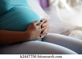 Young mother's pregnant belly Young mother's pregnant belly