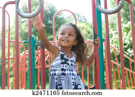 A beautiful mixed race child enjoying the playground A beautiful mixed race child enjoying the playground