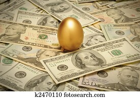 A gold nest egg sitting on a layer of cash of various American banknote denominations