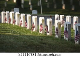 Grave markers with flags at Arlington National Cemetery on Memorial Day