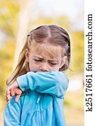 Coughing or sneezing into arm