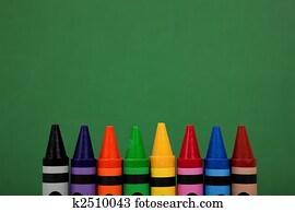 crayon tops with a green chalkboard background