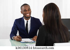 Male Manager Interviewing A Female Applicant