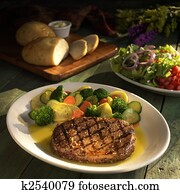 Steak with vegetables and salad Steak with vegetables and salad