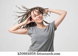 Caucasian woman in good mood dancing isolated on white background.