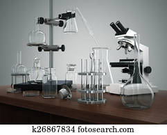 Test tubes with laboratory equipment and microscope on the table