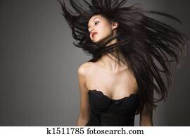 Woman flinging long hair.