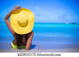 Young woman in yellow hat during caribbean vacation