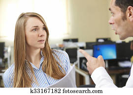 Aggressive Businessman Shouting At Female Colleague