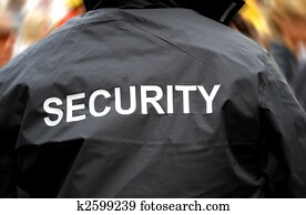 back of a security guard in front of blurred crowd back of a security guard in front of blurred crowd