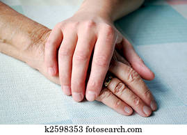 close-up of two hands on the table with daylight.