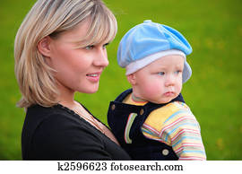 close-up portrait mother with son on hands