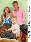 family sit on floor on pillow 2 family sit on floor on pillow 2