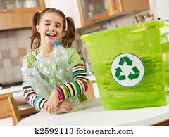 girl recycling plastic bottles