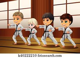 Kids Practicing Martial Arts in the Dojo Kids Practicing Martial Arts in the Dojo
