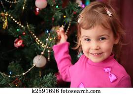 little girl and christmas fir 2 little girl and christmas fir 2