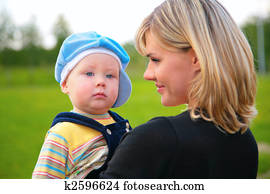 portrait mother with son on hands