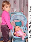 small girl with the doll in the carriage 2 small girl with the doll in the carriage 2