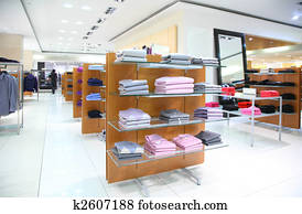 Clothing on shelfs in store Clothing on shelfs in store