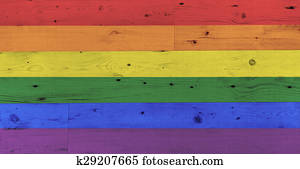 gay pride rainbow flag pattern on wooden surface