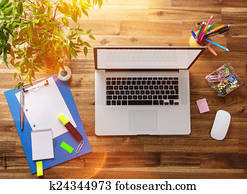 Office workplace with wooden desk.