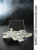 Suitcase with dollars against smoke
